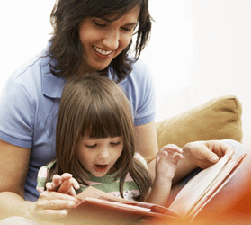 mother and preschool child reading a book together