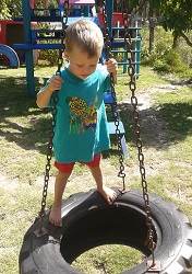 kid on swing